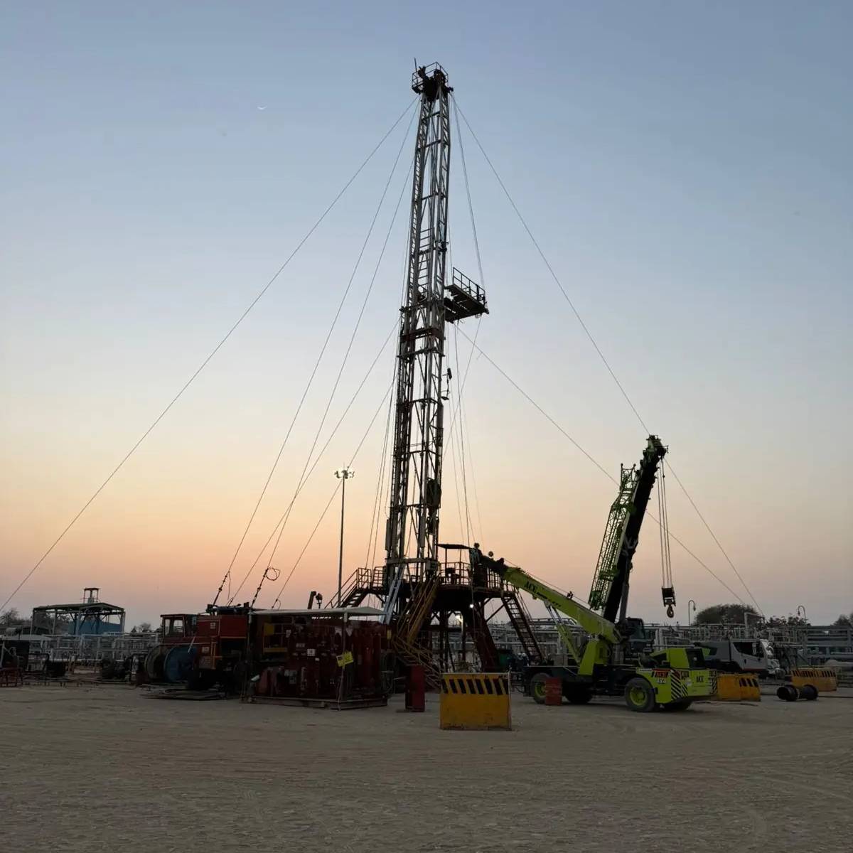 Oil field sunset with pump jacks - Fuel Transportation